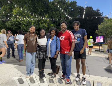 parents, two daughters, and a son posing for a picture