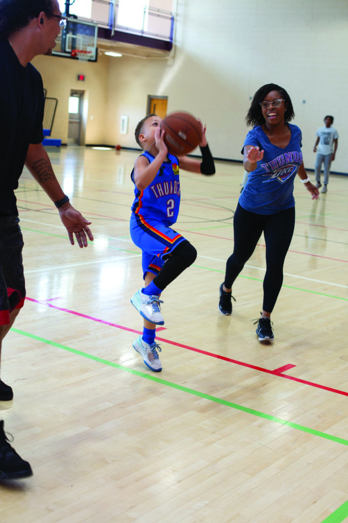 Huff family plays basketball together at YMCA. family membership, developmental sports