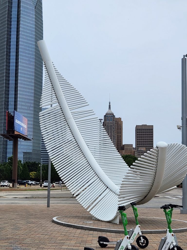 “Taking Flight: Light as a Feather” is a 31-foot-high, 14,000-pound sculpture resembling a feather floating.