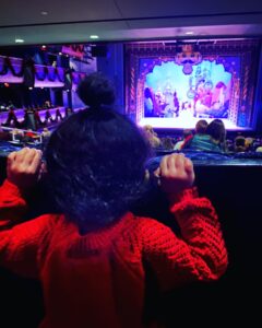 A toddler watching "The Nutcracker" at a sensory-friendly performance showing fun Christmas activities for families