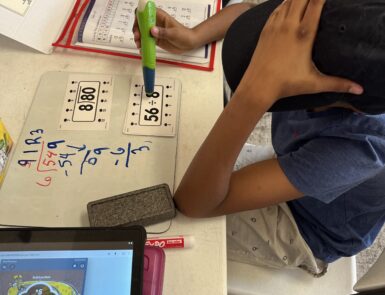 A young student practicing building good study habits