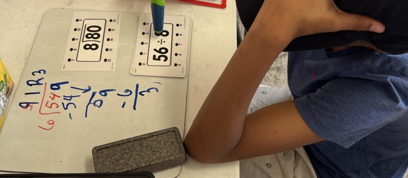 A young student practicing building good study habits