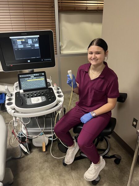 MOORE PUBLIC SCHOOLS STUDENT ABBY SHAW sits by an ultrasound machine while working at an internship through career readiness program through her school. 